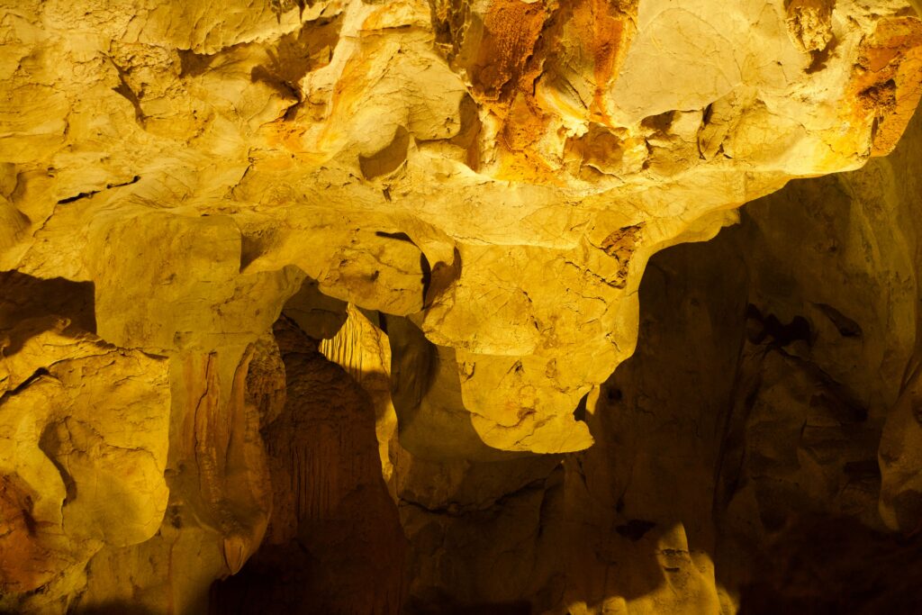 A cave with many different colored rocks