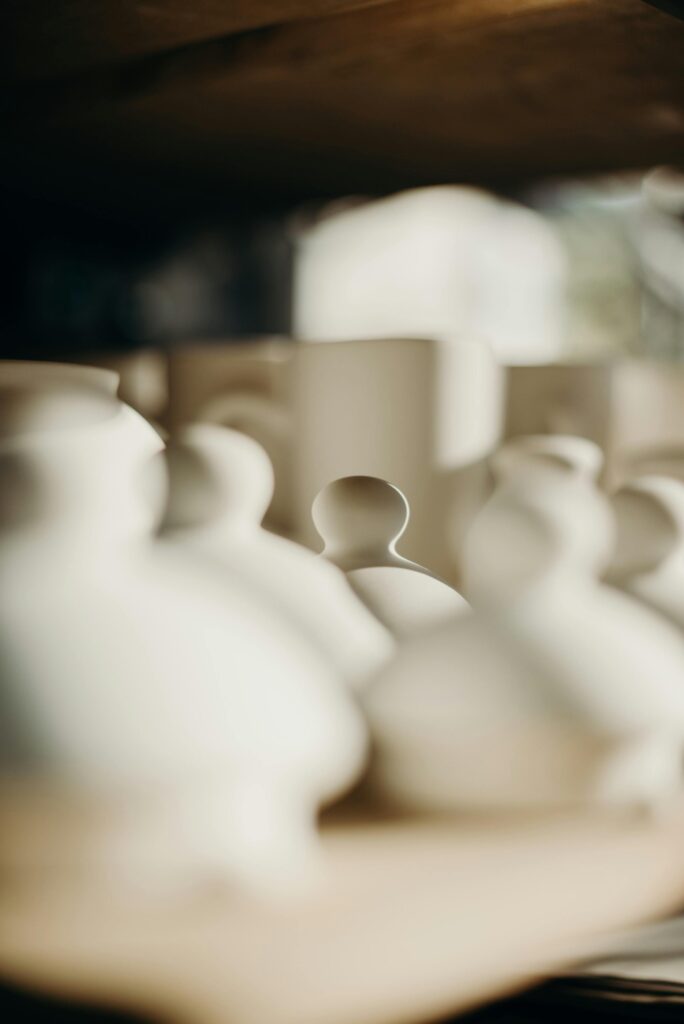 Blurred ceramics on display create an artistic and rustic ambiance.